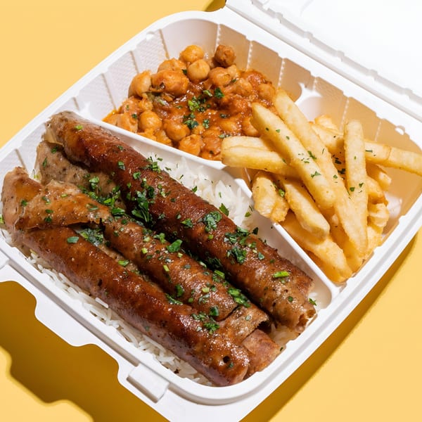 Sheesh Grill's Middle Eastern meal with sausages, rice, chickpeas, and french fries in a takeout container.